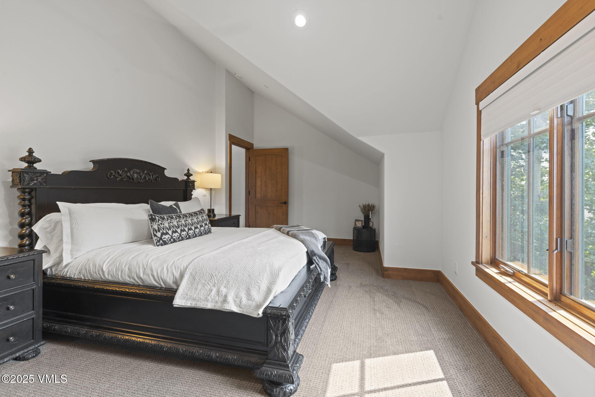 254 Pine Marten Way Edwards, CO 81632 - Photo 35 of 46 a bedroom with a bed and a large window