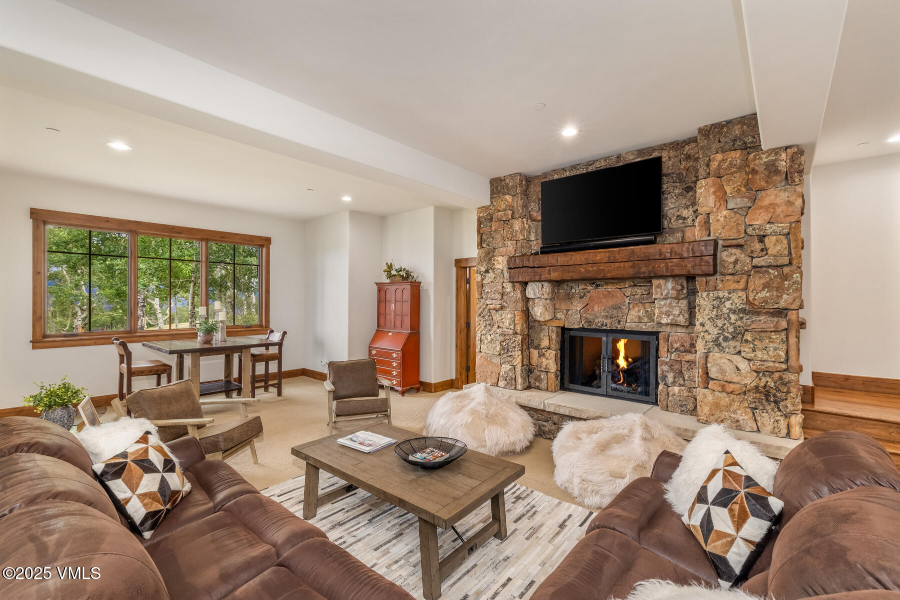 254 Pine Marten Way Edwards, CO 81632 - Photo 37 of 46 a living room with furniture fireplace and flat screen tv