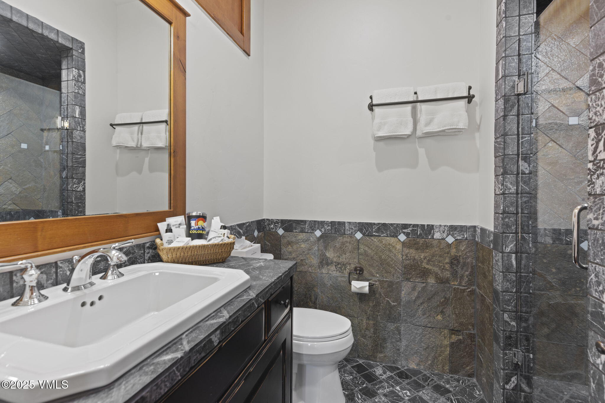 254 Pine Marten Way Edwards, CO 81632 - Photo 40 of 46 a bathroom with a sink toilet and mirror