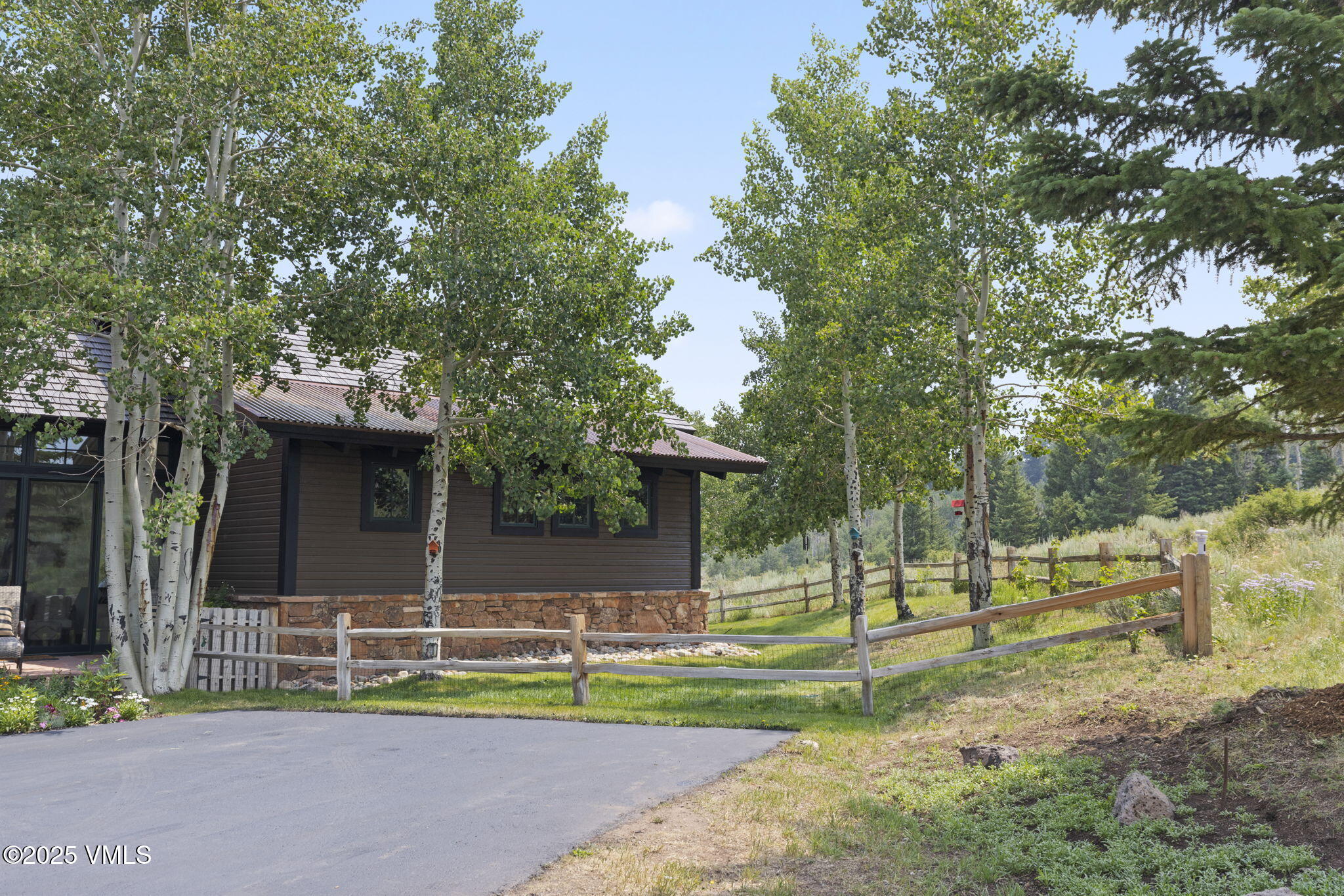 254 Pine Marten Way Edwards, CO 81632 - Photo 46 of 46 a view of a house with backyard and trees