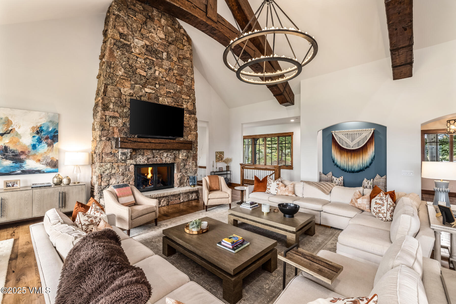 254 Pine Marten Way Edwards, CO 81632 - Photo 8 of 46 a living room with furniture a fireplace and a flat screen tv
