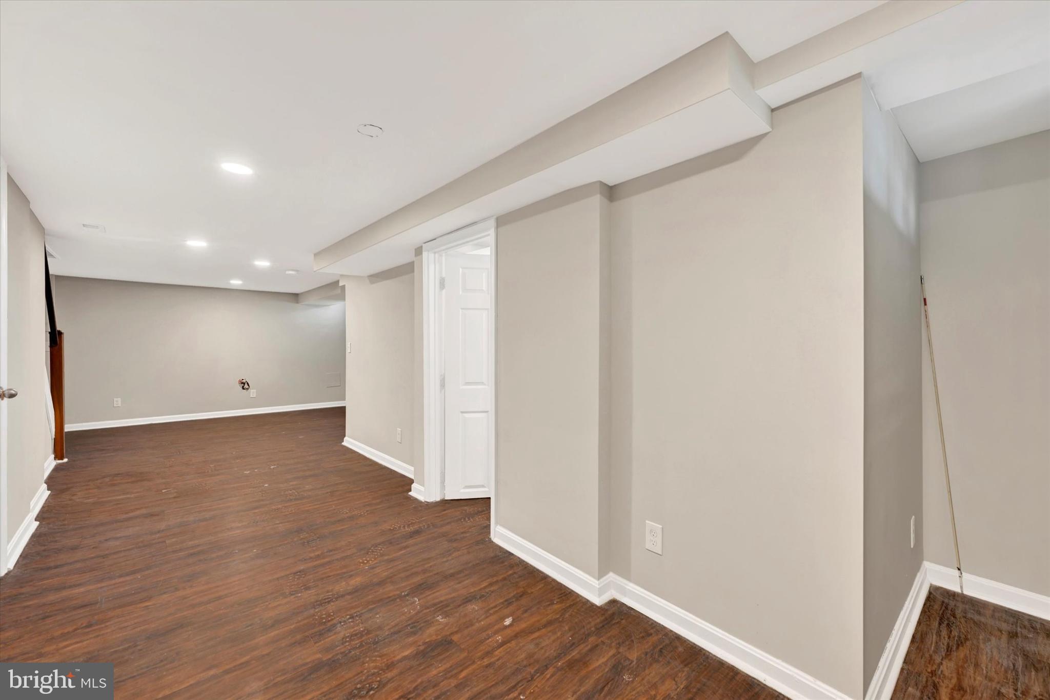 54 Wiltshire Road Essex, MD 21221 - Photo 20 of 22 a view of an empty room with wooden floor