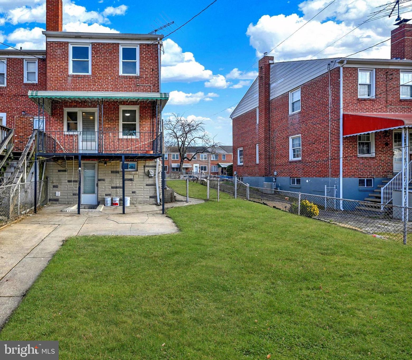 54 Wiltshire Road Essex, MD 21221 - Photo 22 of 22 a front view of a house with a yard table and chairs