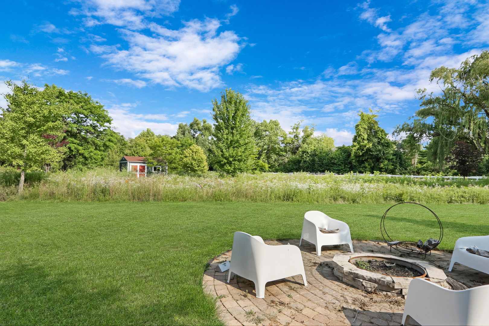 17451 Bridle Trail Road Gurnee, IL 60031 - Photo 11 of 50 a view of a lake with table and chairs