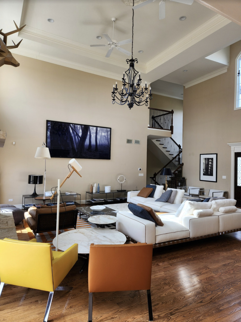 17451 Bridle Trail Road Gurnee, IL 60031 - Photo 16 of 50 a living room with furniture wooden floor and a chandelier