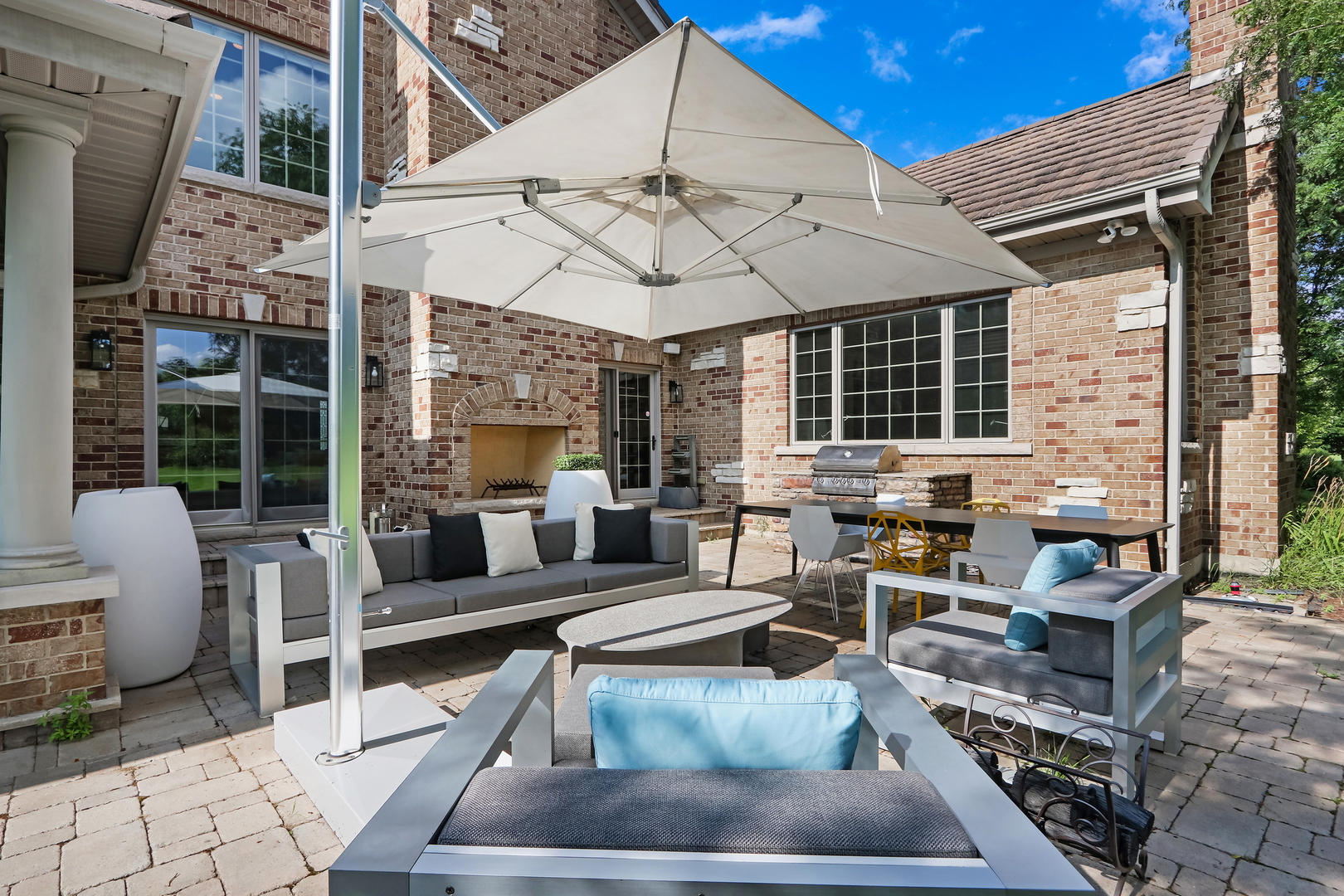 17451 Bridle Trail Road Gurnee, IL 60031 - Photo 6 of 50 a view of a patio with couches table and chairs with wooden floor and fence
