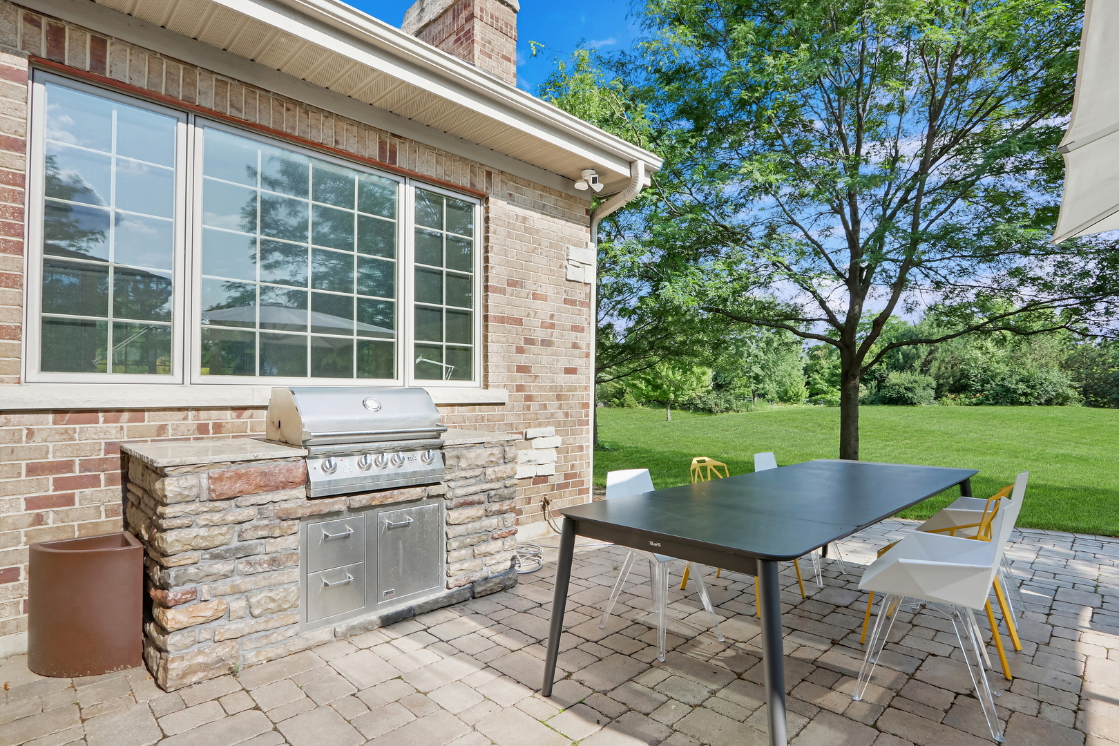 17451 Bridle Trail Road Gurnee, IL 60031 - Photo 8 of 50 a backyard of a house with yard and outdoor seating