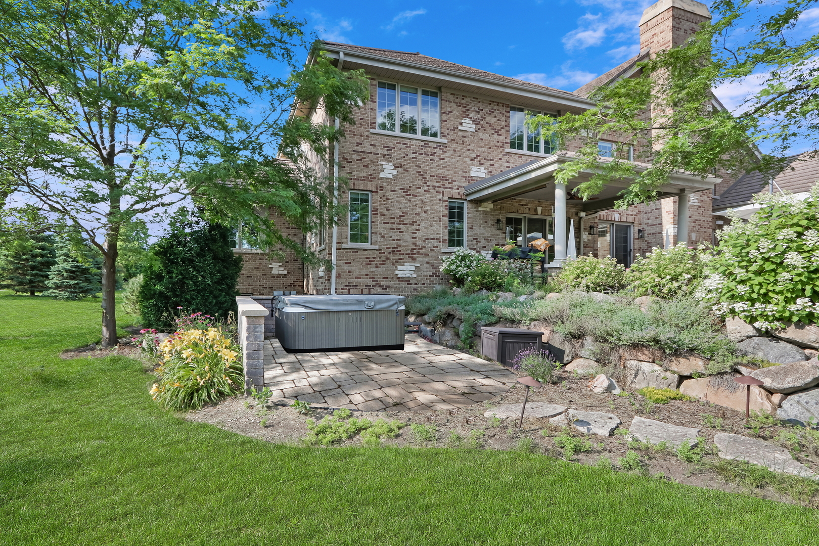 17451 Bridle Trail Road Gurnee, IL 60031 - Photo 9 of 50 a view of a patio with table and chairs potted plants and large tree