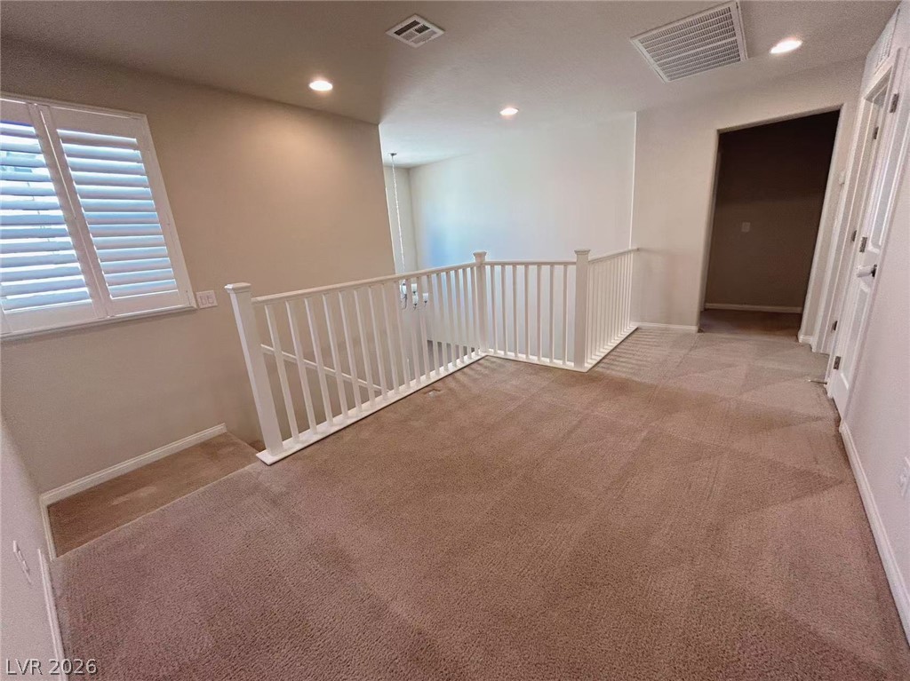 146 Tree Shot Court Las Vegas, NV 89113 - Photo 8 of 18 A well-lit landing provides comfortable transitions with plush carpeting and bright recessed lighting.