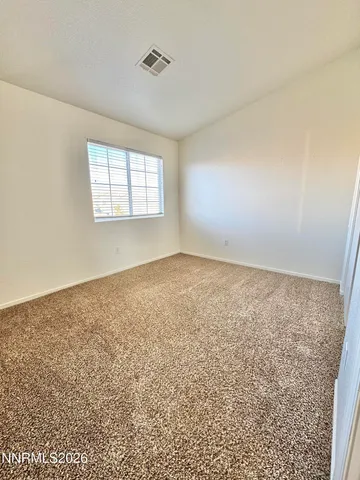 a view of a big yard with a house