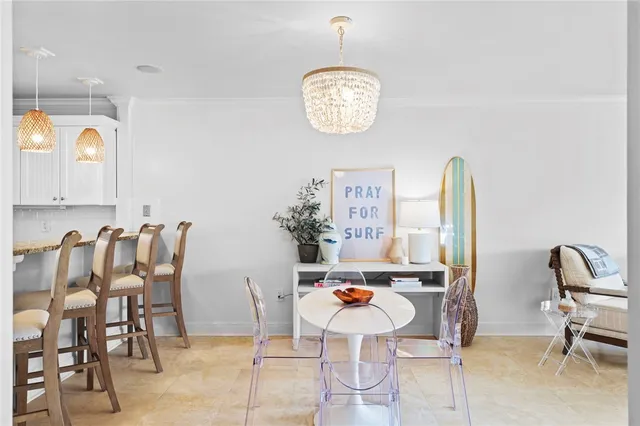 a view of dining room and kitchen with stainless steel appliances