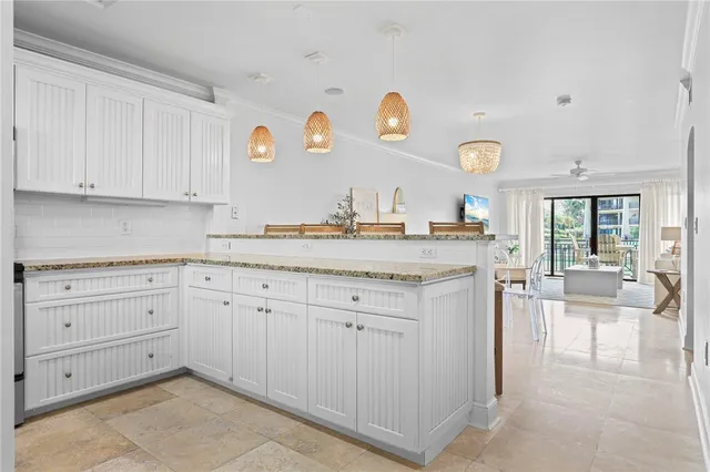a view of cabinets a sink and dishwasher with kitchen appliances