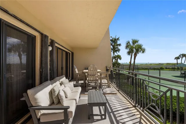 a view of balcony with furniture