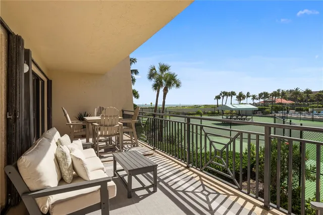a terrace with outdoor seating and city view