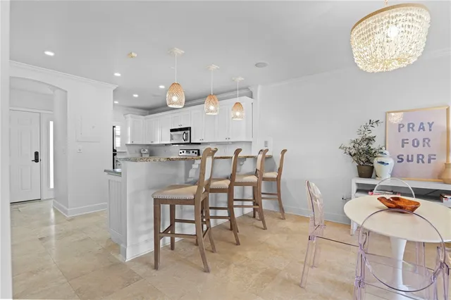 a view of kitchen with cabinets and wooden floor