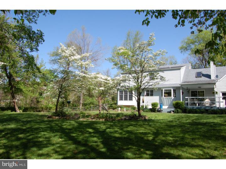 1264 St Peters Road Pottstown, PA 19465 - Photo 2 of 18 a front view of a house with a garden