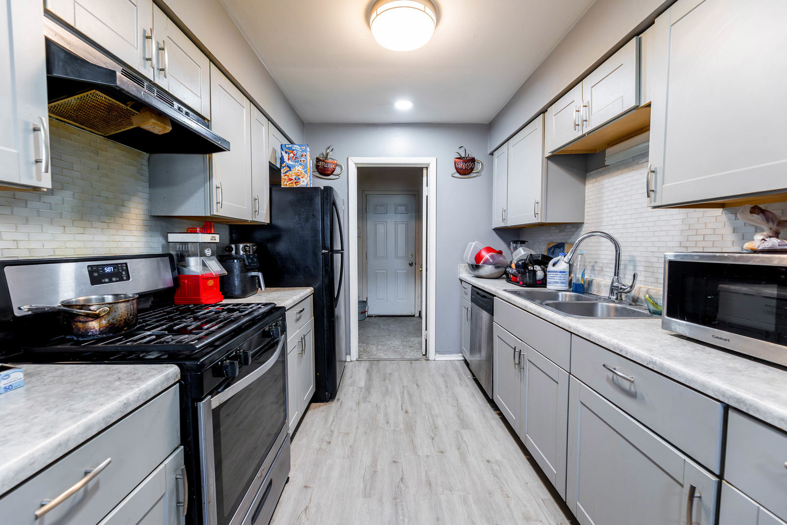 2271 Windsor Lane Country Club Hills, IL 60478 - Photo 6 of 14 a kitchen with stainless steel appliances granite countertop a stove and cabinets