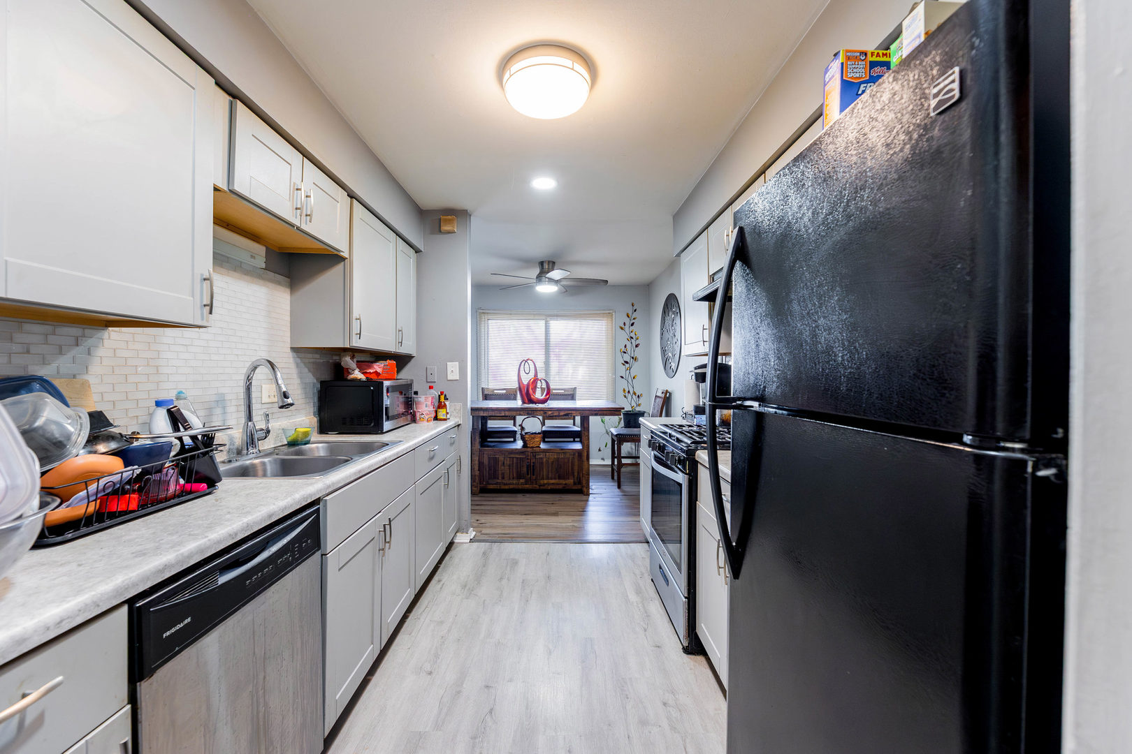 2271 Windsor Lane Country Club Hills, IL 60478 - Photo 7 of 14 a kitchen with a sink and refrigerator