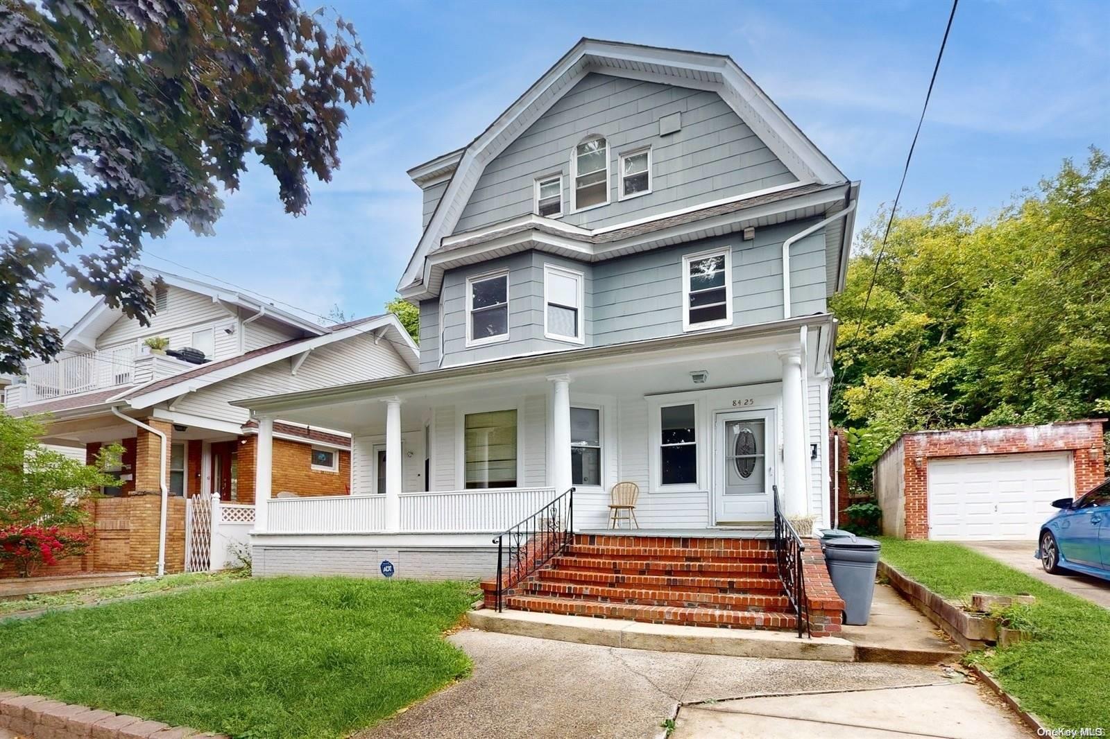84-25 85th Avenue Queens, NY 11421 - Photo 1 of 1 a front view of a house with a yard
