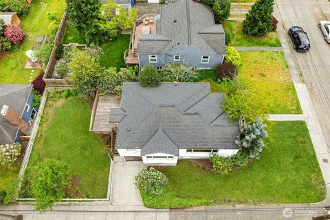 an aerial view of a house with a yard
