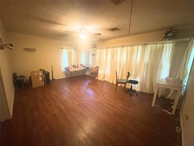 a view of a living room and hardwood floor