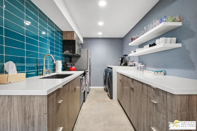 a kitchen with a sink and cabinets