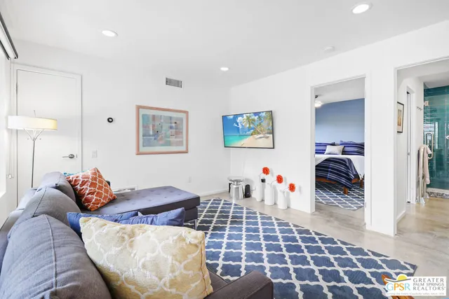 a bedroom with furniture and a walk in closet