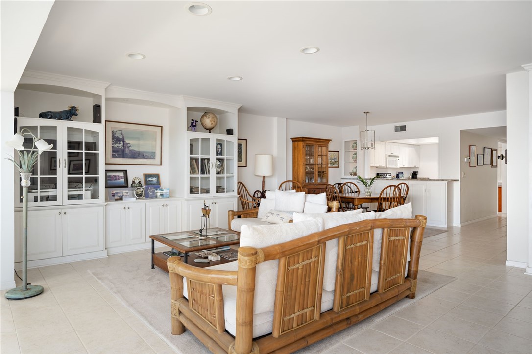 1870 Bay Road, Unit 213G Vero Beach, FL 32963 - Photo 13 of 36 a kitchen that has a lot of white cabinets and stainless steel appliances