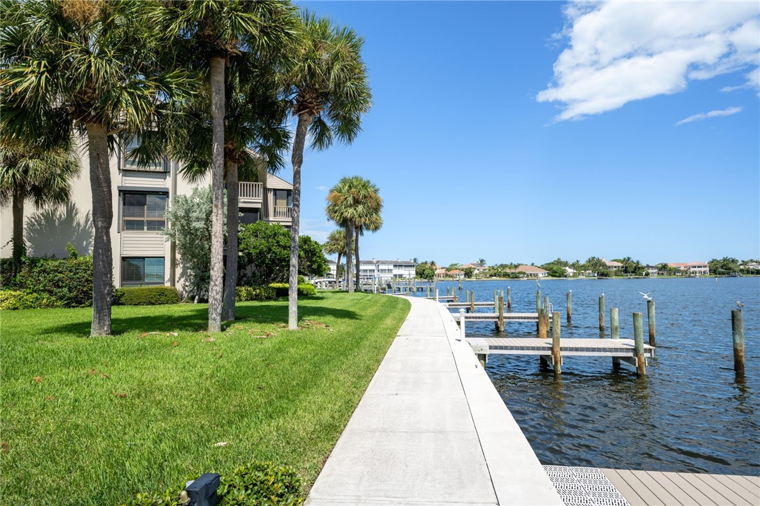 1870 Bay Road, Unit 213G Vero Beach, FL 32963 - Photo 26 of 36 a view of a house with a yard