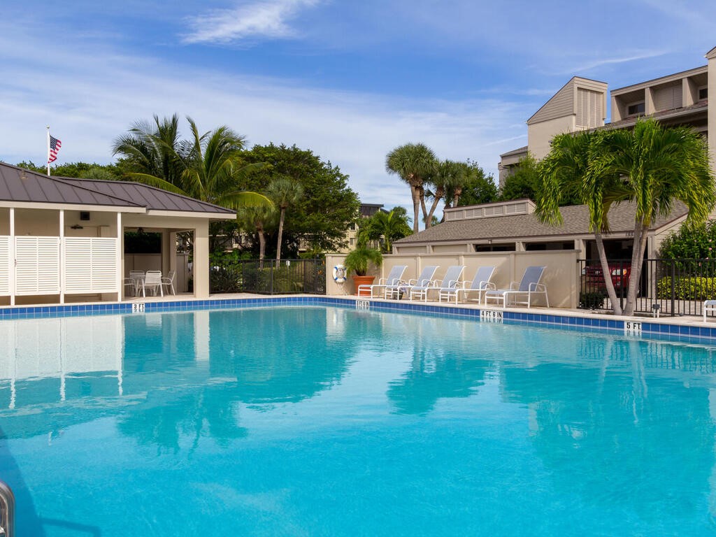 1870 Bay Road, Unit 213G Vero Beach, FL 32963 - Photo 30 of 36 a view of a house with pool yard and sitting area