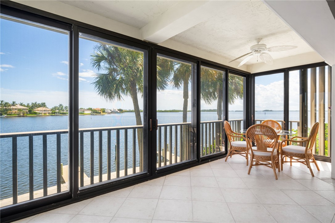1870 Bay Road, Unit 213G Vero Beach, FL 32963 - Photo 4 of 36 a balcony with furniture and water view