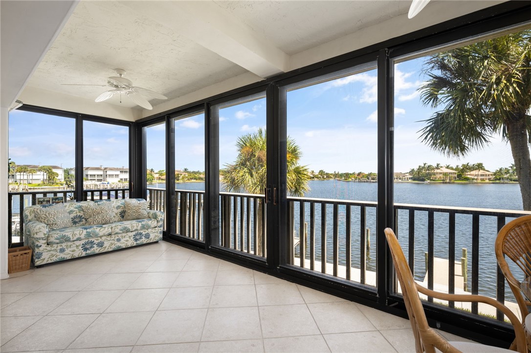1870 Bay Road, Unit 213G Vero Beach, FL 32963 - Photo 5 of 36 a view of a porch with furniture