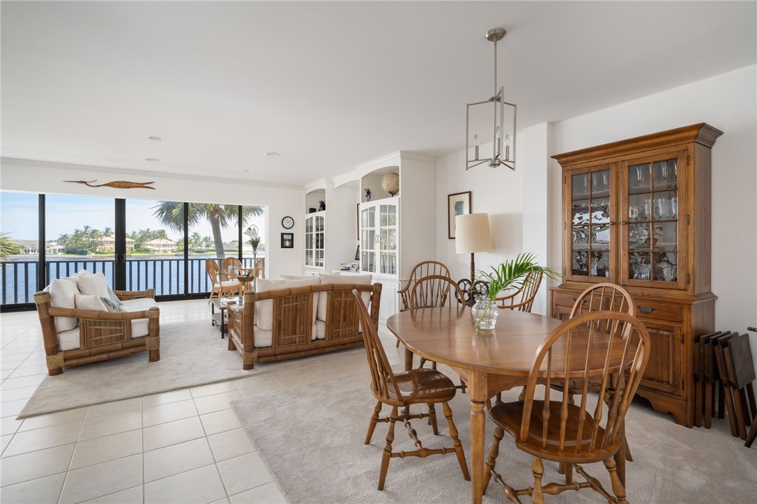 1870 Bay Road, Unit 213G Vero Beach, FL 32963 - Photo 6 of 36 a dining room with furniture and window