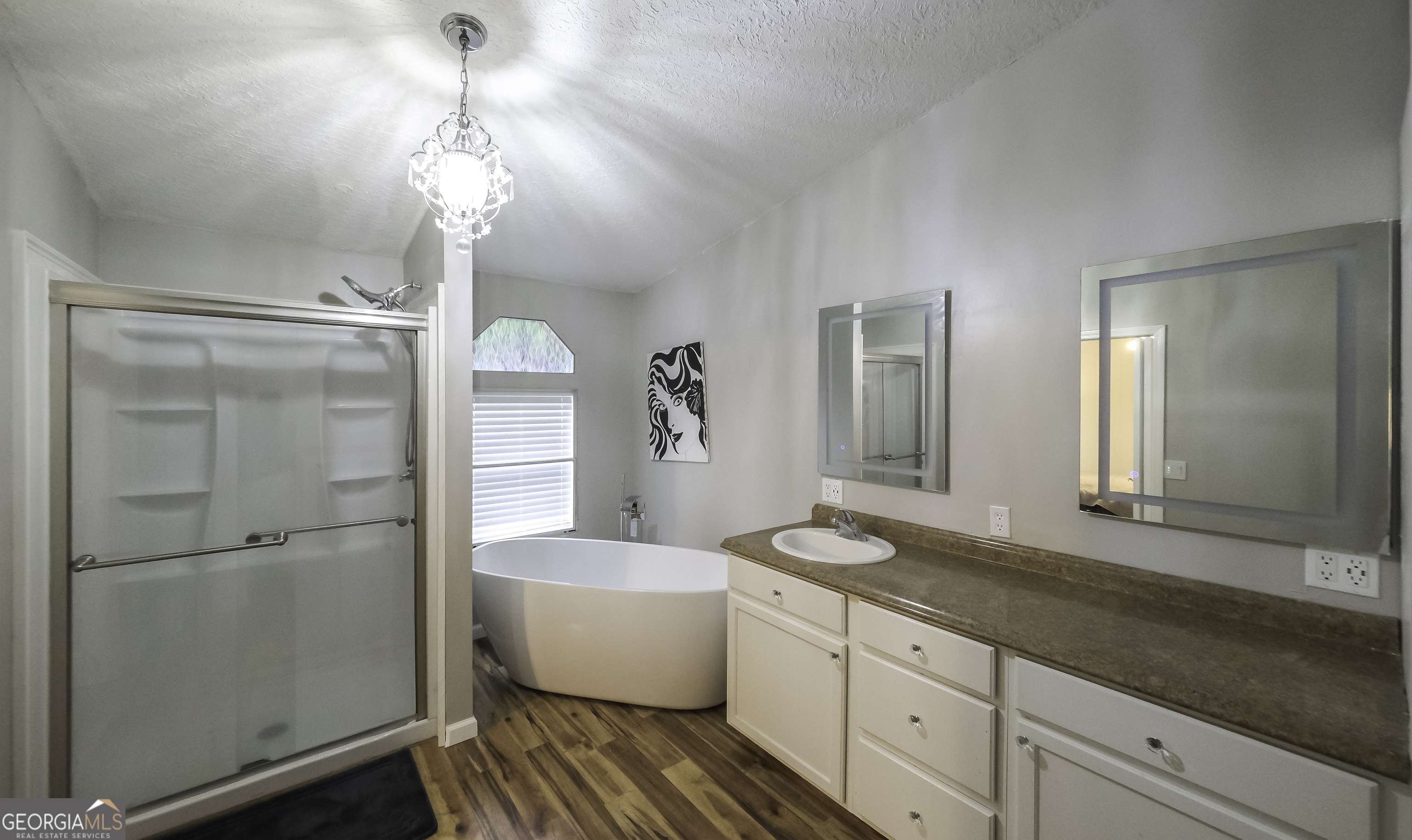 91 Holder Road Temple, GA 30179 - Photo 24 of 40 a spacious bathroom with a granite countertop sink mirror and toilet