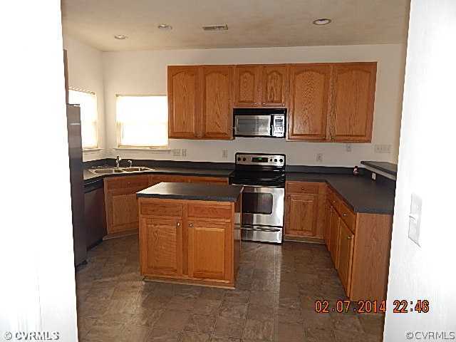 14724 Clover Ridge Lane Chesterfield, VA 23832 - Photo 3 of 7 a kitchen with stainless steel appliances granite countertop a stove a sink and a microwave