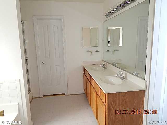 14724 Clover Ridge Lane Chesterfield, VA 23832 - Photo 5 of 7 a bathroom with a sink and a mirror
