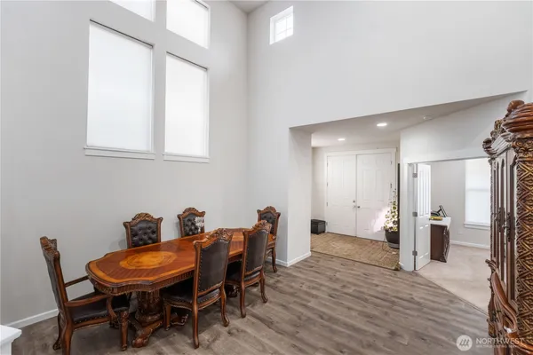 a view of a dining room with furniture and window