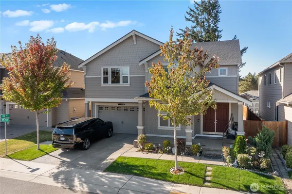 a front view of a house with garden