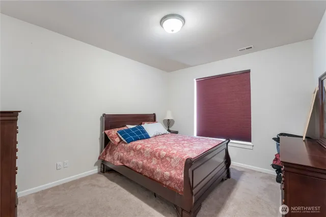 a room with a bed and window