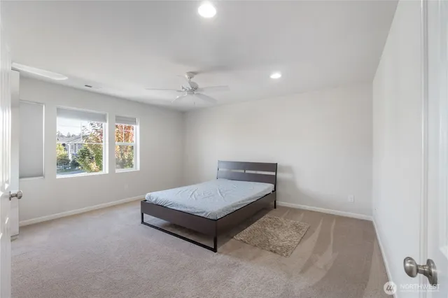a bathroom with a sink vanity granite tub and shower