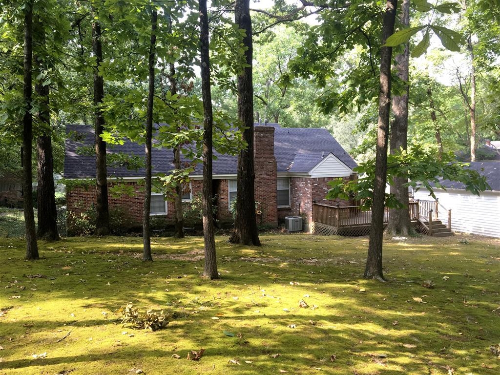 5482 North Rolling Oaks Drive Memphis, TN 38119 - Photo 3 of 4 a view of a street with an trees