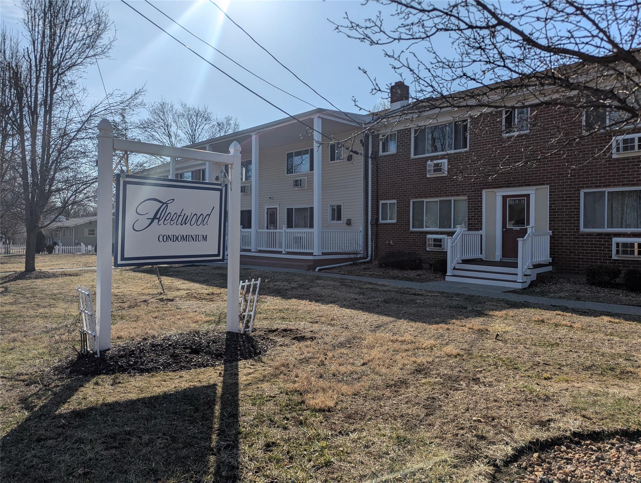a brick building with a sign broad of it