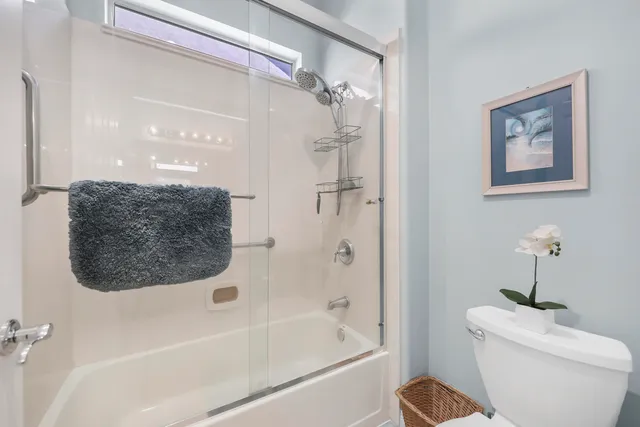 a bathroom with a toilet a sink and bathtub