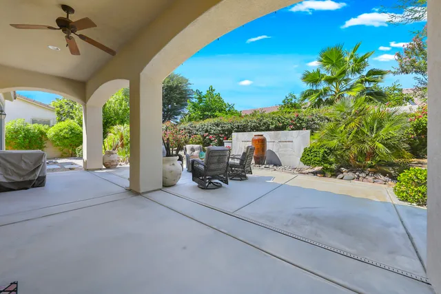a view of a patio with table and chairs potted plants with wooden floor