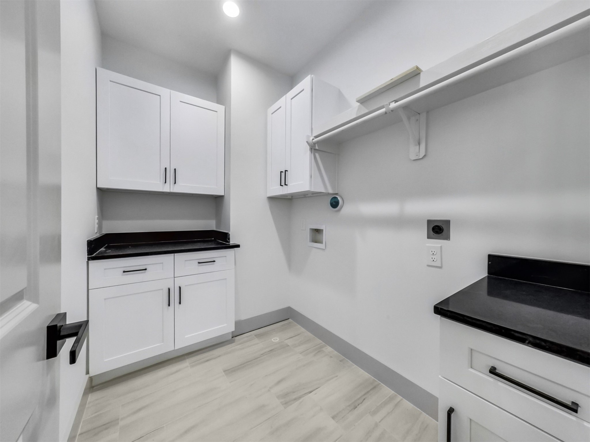 2410 Vaughn Street, Unit B Houston, TX 77093 - Photo 13 of 26 Spacious laundry room with ample storage and sleek cabinetry