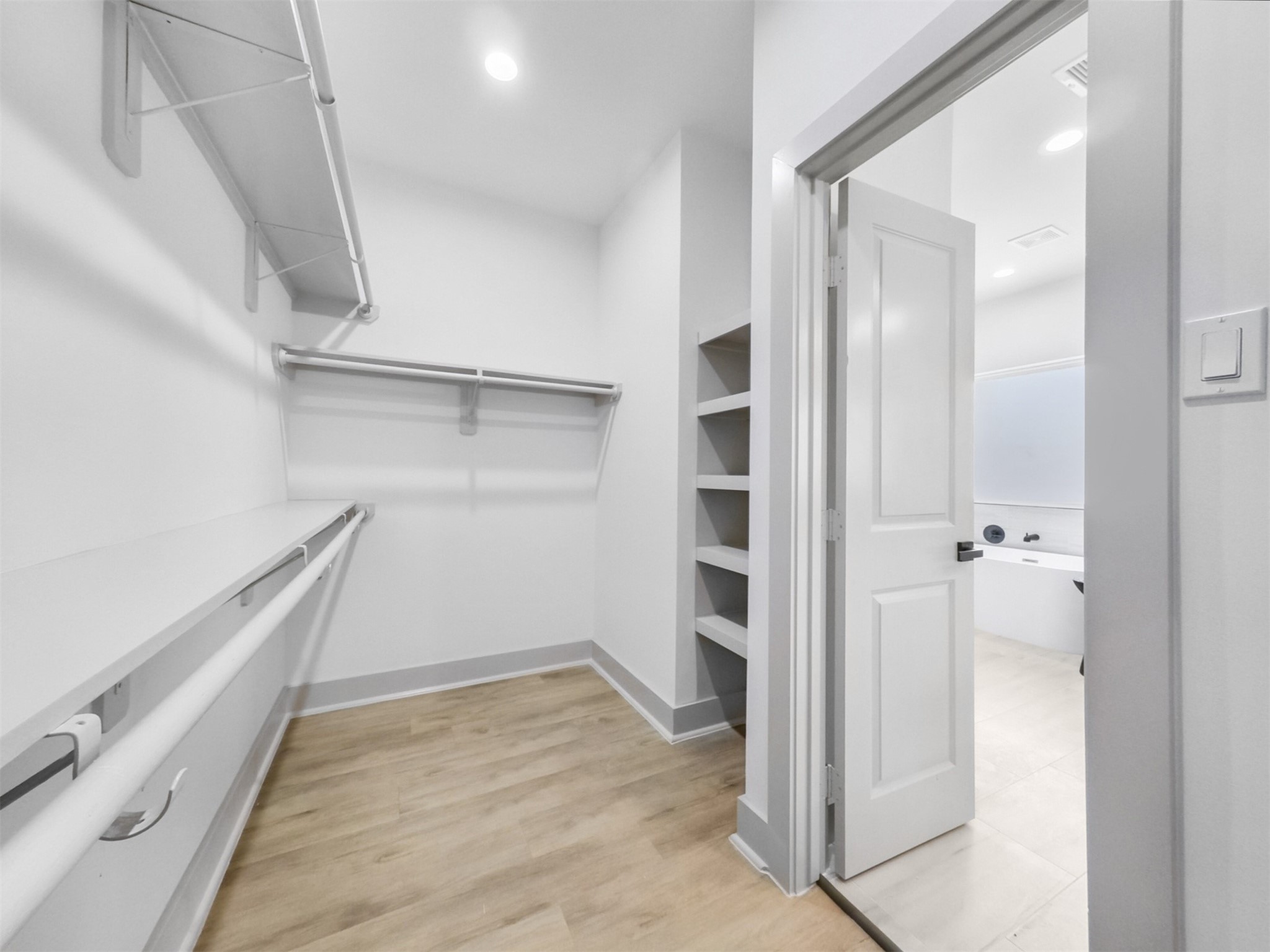 2410 Vaughn Street, Unit B Houston, TX 77093 - Photo 20 of 26 Spacious walk-in closet with built-in shelves and ample storage