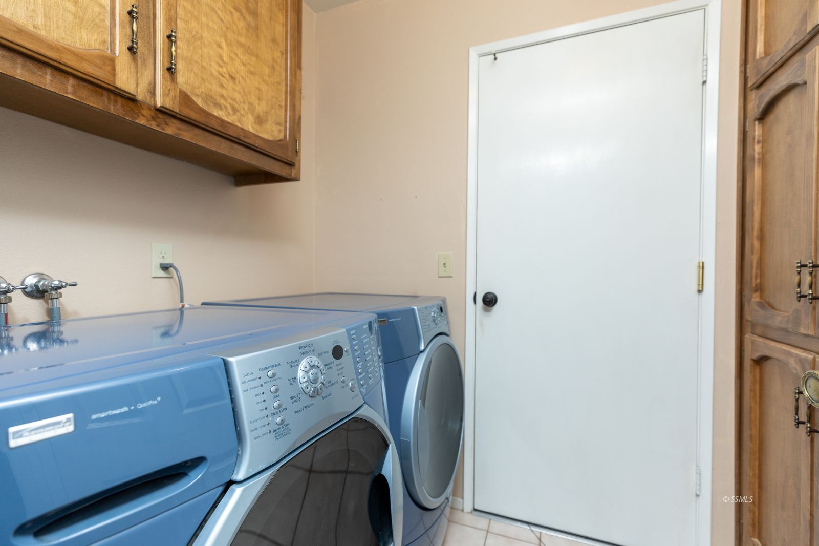 213 Washington Way Ridgecrest, CA 93555 - Photo 22 of 25 a view of storage and utility room with washer and dryer