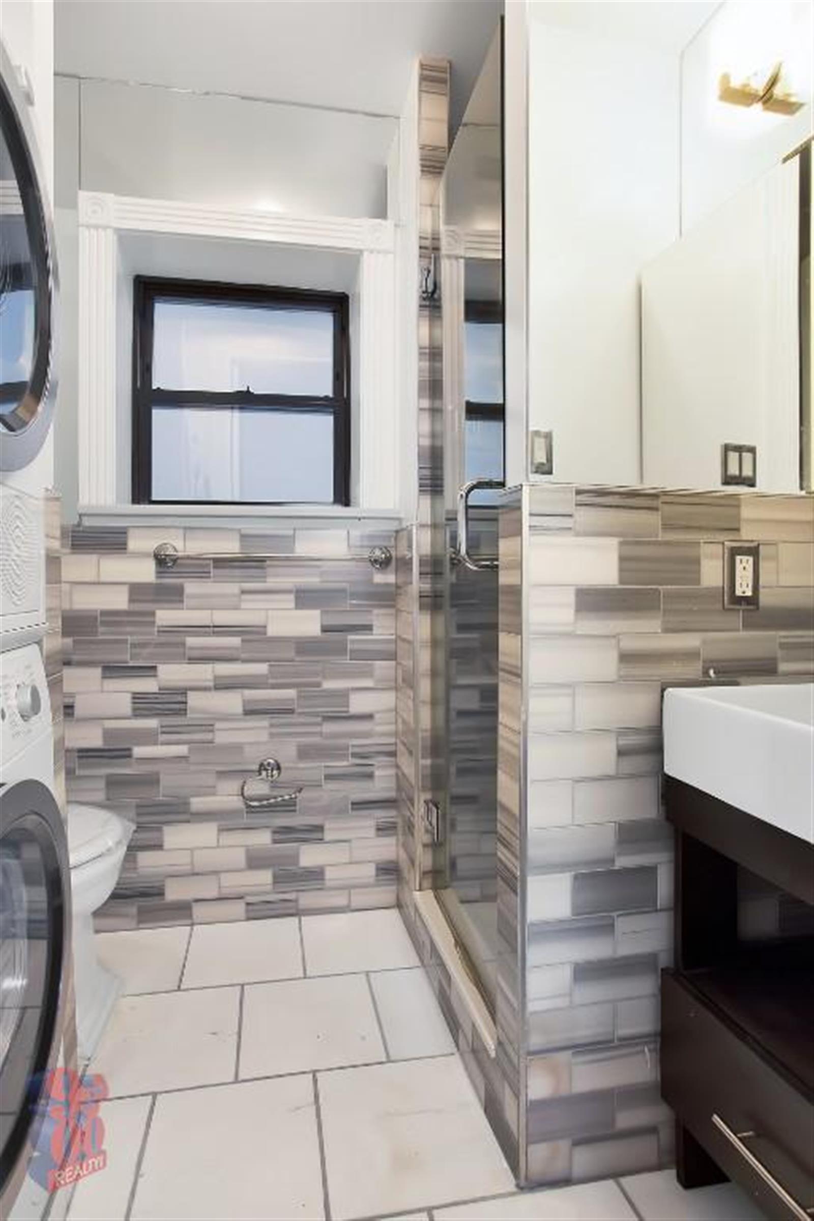 246 Mott Street, Unit 7 Manhattan, NY 10012 - Photo 5 of 6 a bathroom with a sink and a mirror