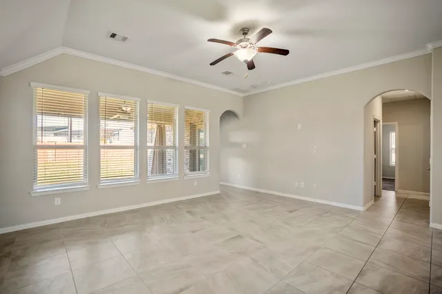 a view of a kitchen with a refrigerator and microwave
