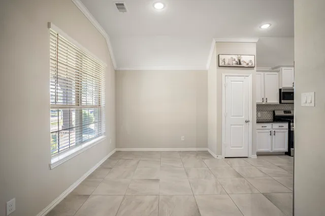 a view of a dining room with furniture window and outside view